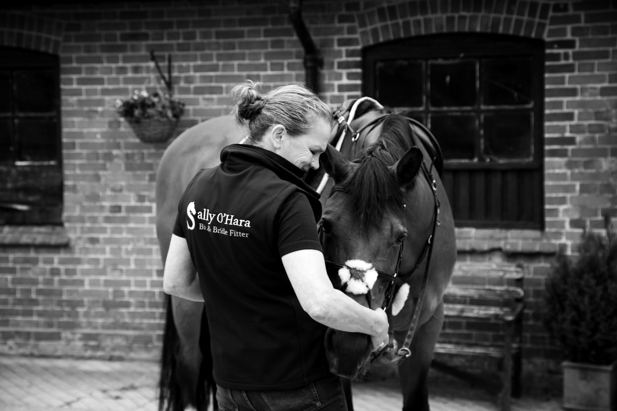 Sally O'Hara fitting a bridle at the yard